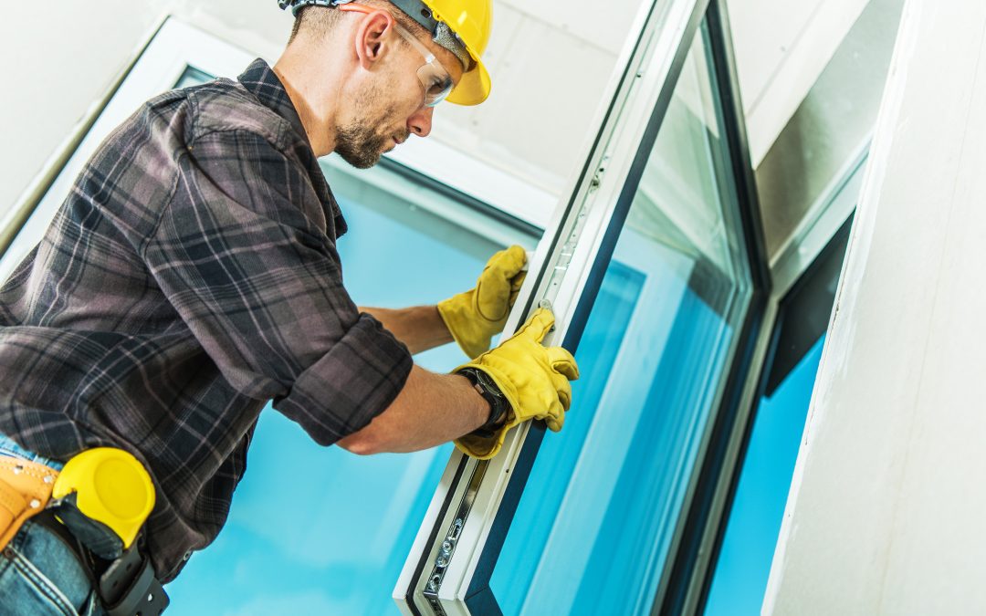 Contractor installing windows